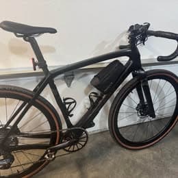 Black Trek Checkpoint SL gravel bike in a workshop